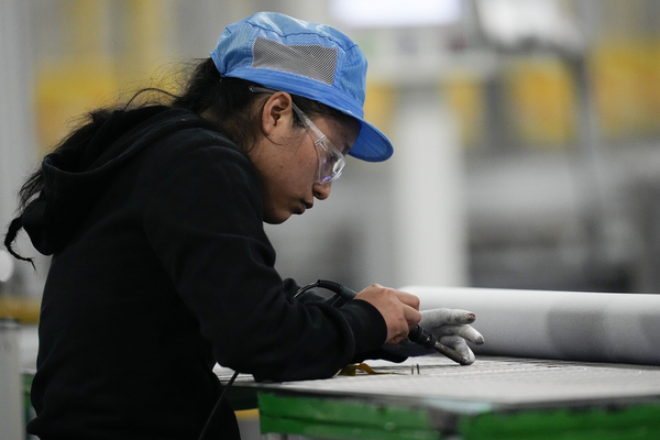 An employee works inside a Qcells solar plant in Dalton, Georgia.