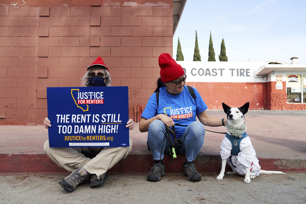 Housing justice advocates wait to march earlier this year in Los Angeles.