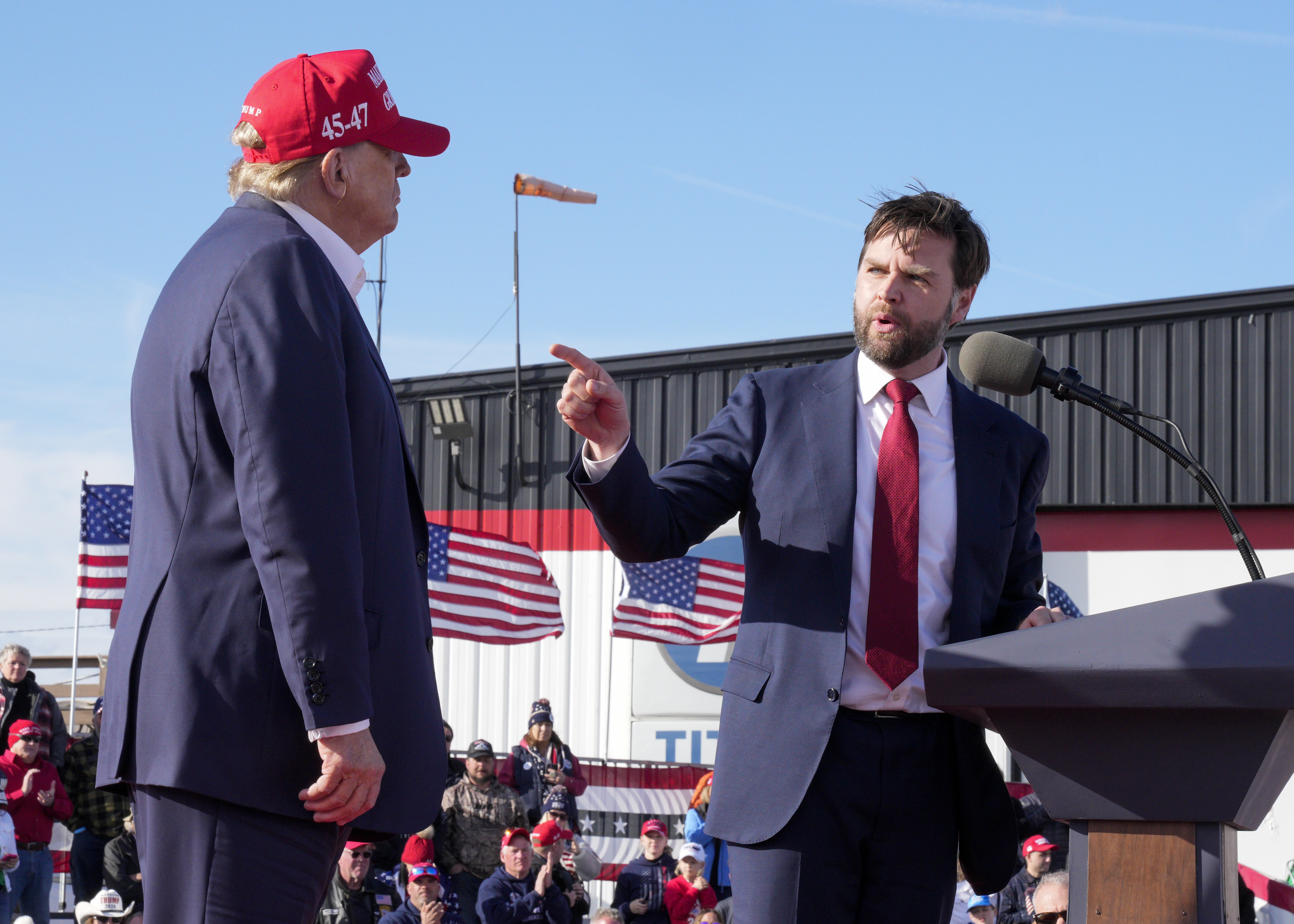 Sen. J.D. Vance (R-Ohio), right, points toward Republican presidential candidate former President Donald Trump at a March 16 campaign rally in Vandalia, Ohio.