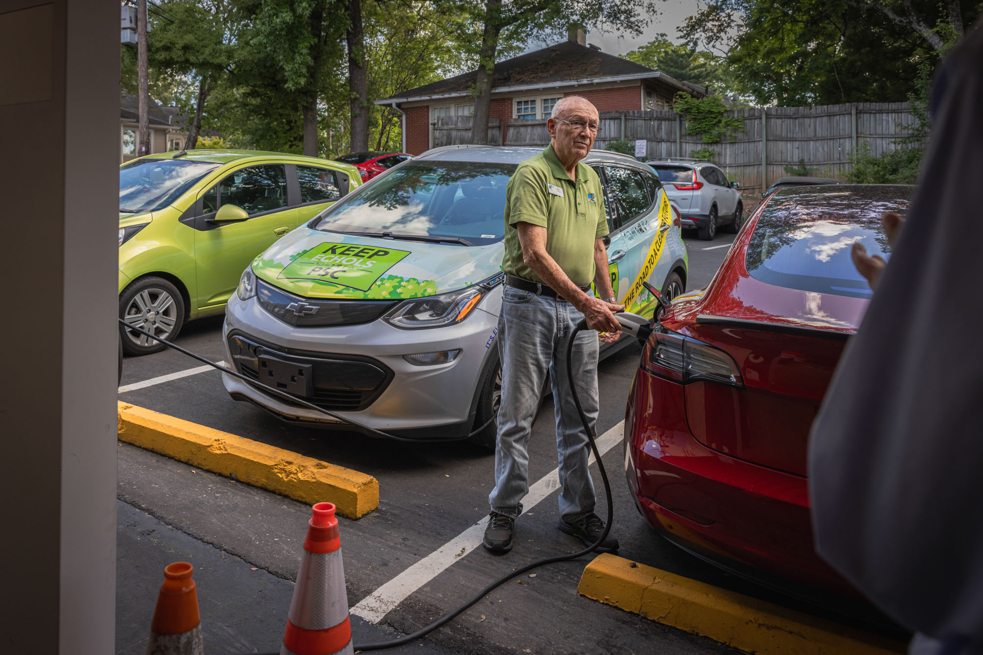 Francis charges his Tesla at a station he helped established a decade ago.